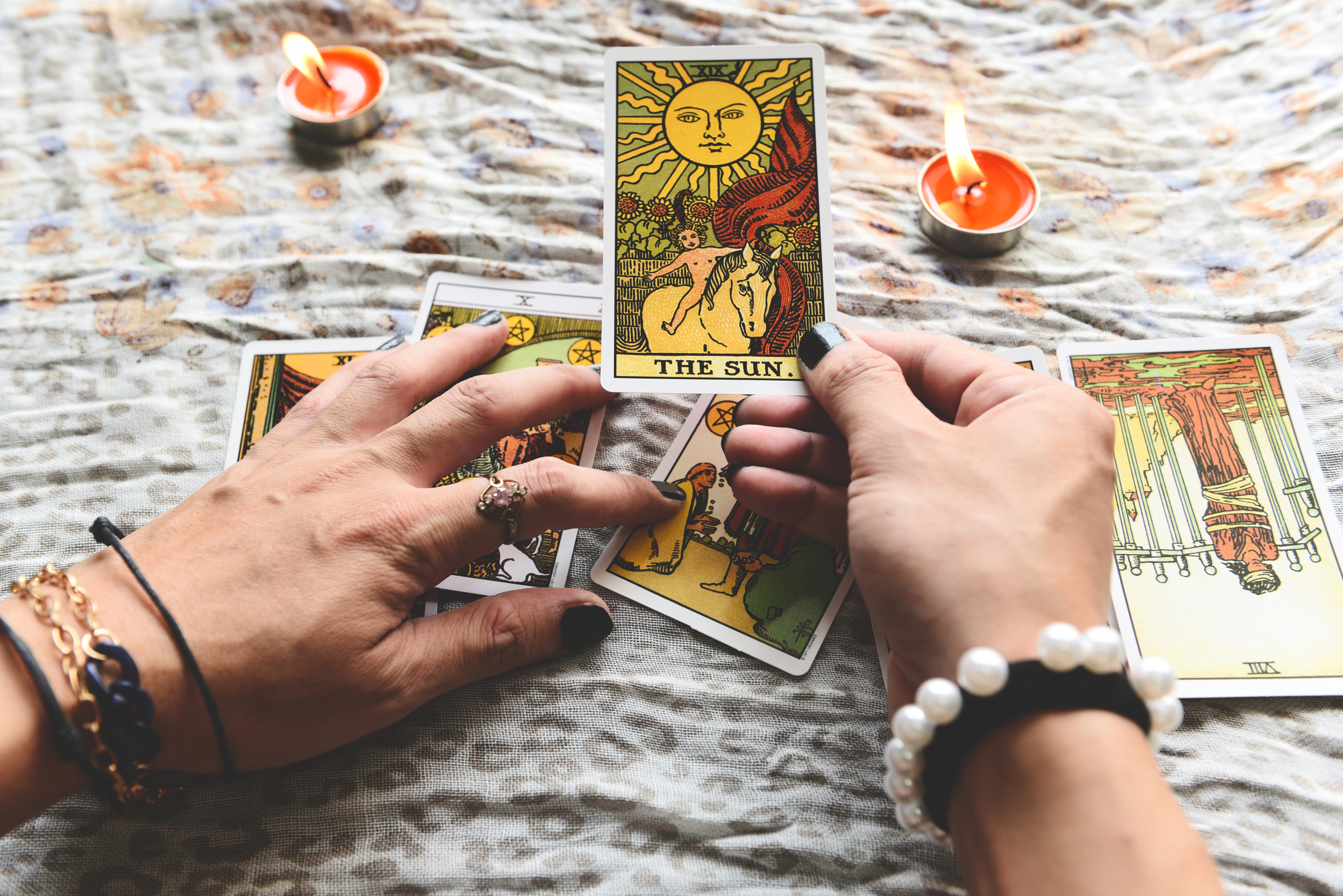  Fortune Teller's Hands Holding Tarot Cards with Candlelight